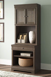 Janismore - Weathered Gray - Bookcase - JaxCo Furniture