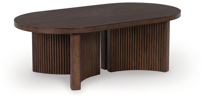 Korestone - Dark Brown - Oval Cocktail Table - JaxCo Furniture