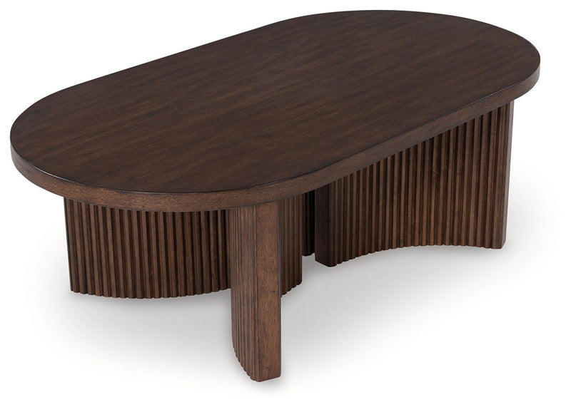 Korestone - Dark Brown - Oval Cocktail Table - JaxCo Furniture
